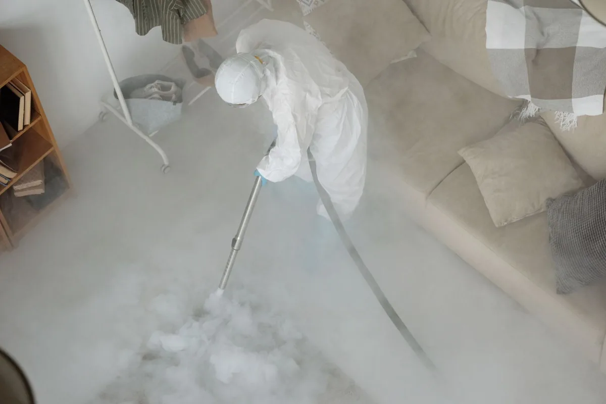 Biohazard cleanup technician in protective equipment, Willimantic, CT